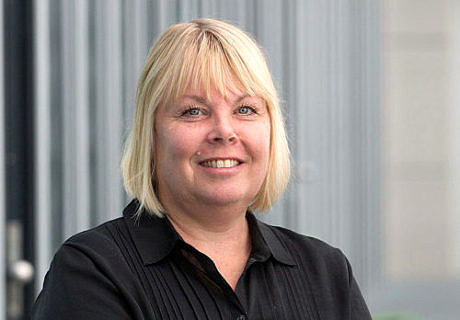 A blond woman, called Prof. Dr. Sannakaisa Virtanen, dressed in black is smiling.